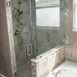 NICE CUSTOM TILE SHOWER WITH SOAKER TUB COMBO AND CUSTOM FRAMELESS GLASS ENCLOSER