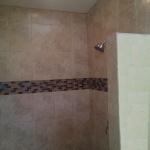 12X9 CERAMIC WITH GLASS BORDER OPEN TO CEILING 3/4 WALL BRUSED NICKEL FAUCET
