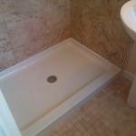 STERLING SHOWER PAN WITH MOSAIC MAIN FLOOR TILE AND CERAMIC WALL TILES