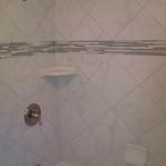 BATHTUB REMODEL WITH WHITE MARBLE PORCELIN TILE SET AT DIAGONAL