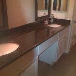CUSTOM BUILT IN VANITY WITH BROWN ANTIQUE GRANITE