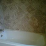 NEW CAST IRON TUB WITH DIAGONAL TILE AFTER