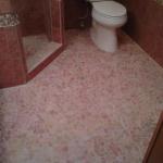 NEW TILE FLOOR WITH  WALL TILE ON MAIN AREA WALLS. STONE EFFECT MOSAICS.