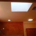 CEILING AFTER SOFFITS REMOVED WITH NEW RECESS LIGHTS AND EXHAUST FAN.