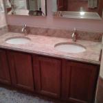 DUAL UNDER MOUNT SINKS WITH CUSTOM GRANITE 1 HOLE FAUCETS AND WATERFALL EDGE. 