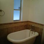 NEW CLAW FOOT TUB WITH WAINSCOTTING TILE